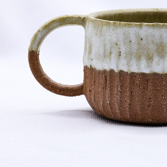 Handmade ceramic Terra Stoneware Mug by Ribera Handmade Ceramics, featuring a rustic, textured finish and unique artisanal design.