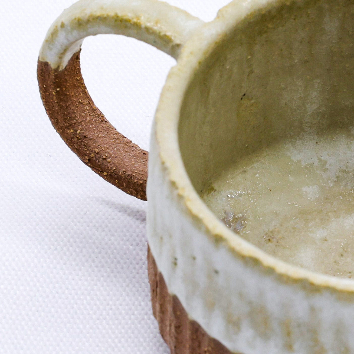 Handmade Terra Stoneware Mug by Ribera Handmade Ceramics featuring a textured ceramic surface and earthy tones.