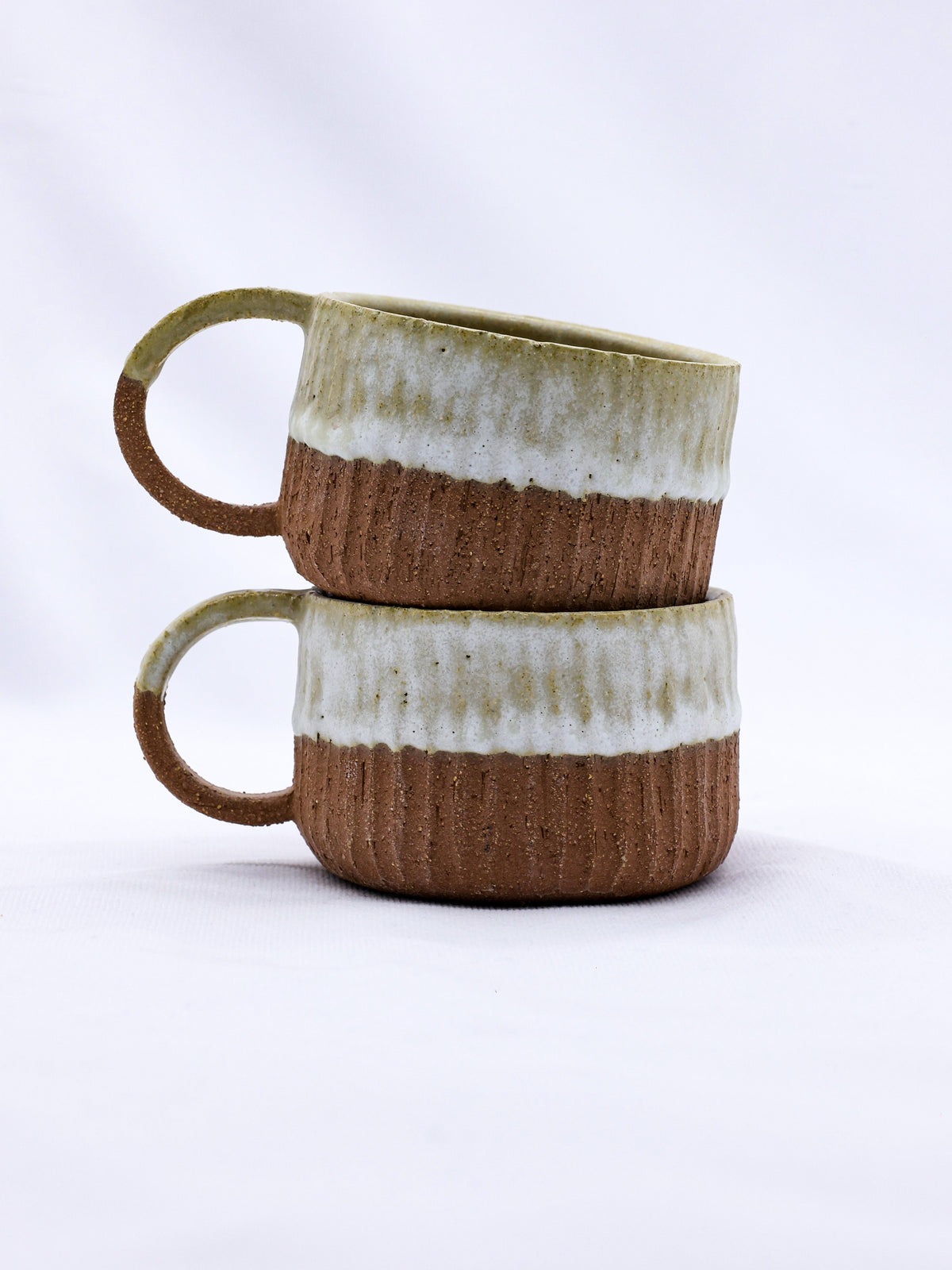 Handmade ceramic Terra Stoneware mug from Bianca Arte by Ribera Handmade Ceramics, showcasing its textured, earthy design.