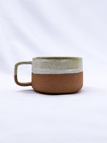 Bianca Grande handmade ceramic Terra Stoneware mug by Ribera Handmade Ceramics, showcasing textured earthy finish and rounded handle.