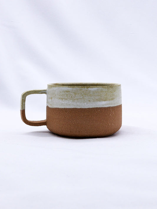 Bianca Grande handmade ceramic Terra Stoneware mug by Ribera Handmade Ceramics, showcasing textured earthy finish and rounded handle.