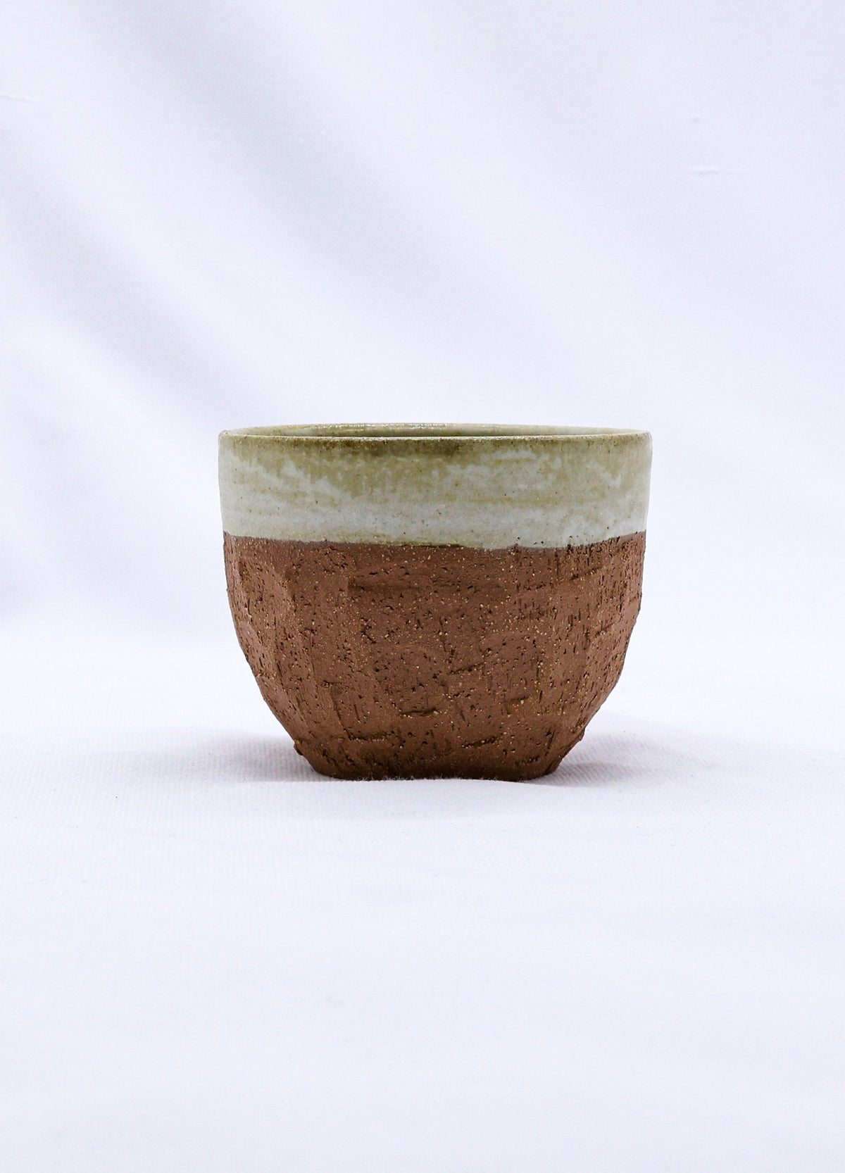 Beige handmade ceramic Terra Stoneware mug by Ribera Handmade Ceramics, featuring a textured, artisanal design.