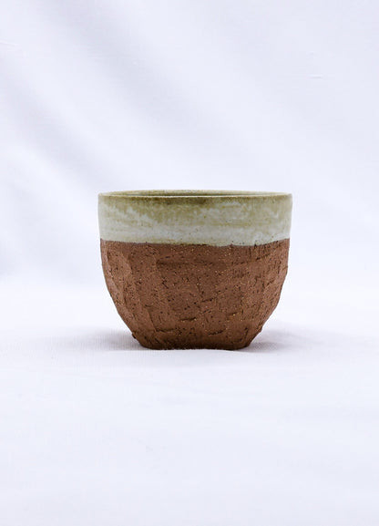 Beige handmade ceramic Terra Stoneware mug by Ribera Handmade Ceramics, featuring a textured, artisanal design.