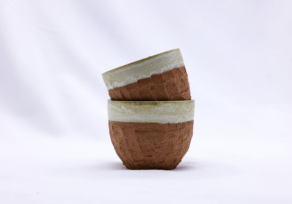 Beige handmade ceramic Terra stoneware mug by Ribera Handmade Ceramics, featuring a textured, artisanal design.