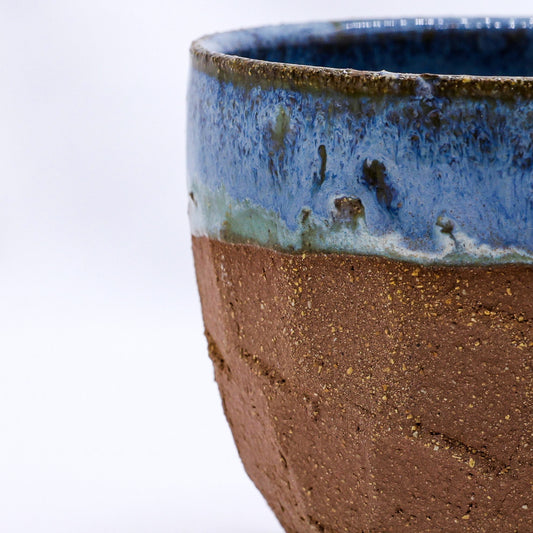 Handmade ceramic Terra stoneware mug by Ribera Handmade Ceramics featuring a sculptural design and earthy glaze.