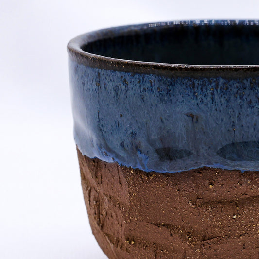 Handmade Terra Stoneware Mug by Ribera Handmade Ceramics with a rustic ceramic sculpture design, in earthy tones.