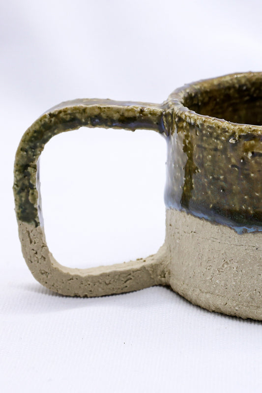 Beige grande handmade ceramic mug with a textured surface, crafted by Ribera Handmade Ceramics, large and perfect for coffee or tea.