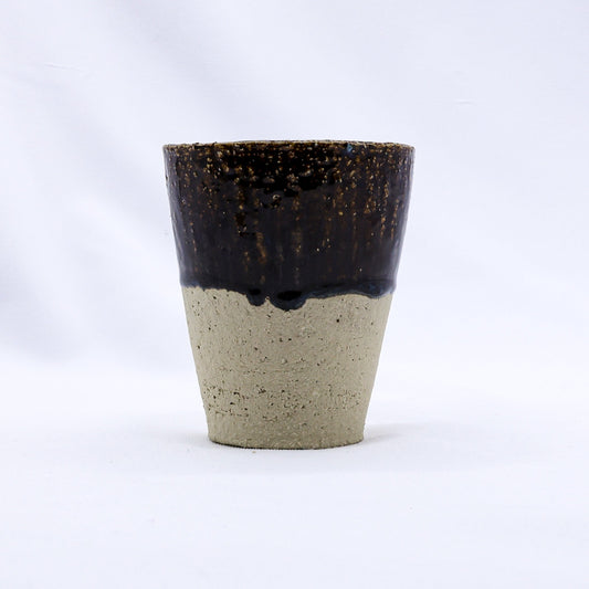 Ribera Handmade Ceramics Bluvio Quadra Milled Stoneware tall ceramic cup with textured handmade finish and earthy tones.