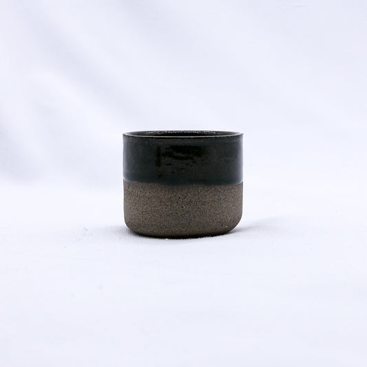 Green Picollo Smoked Grey handmade ceramic espresso mug by Ribera Handmade Ceramics, showcasing its textured stoneware surface.