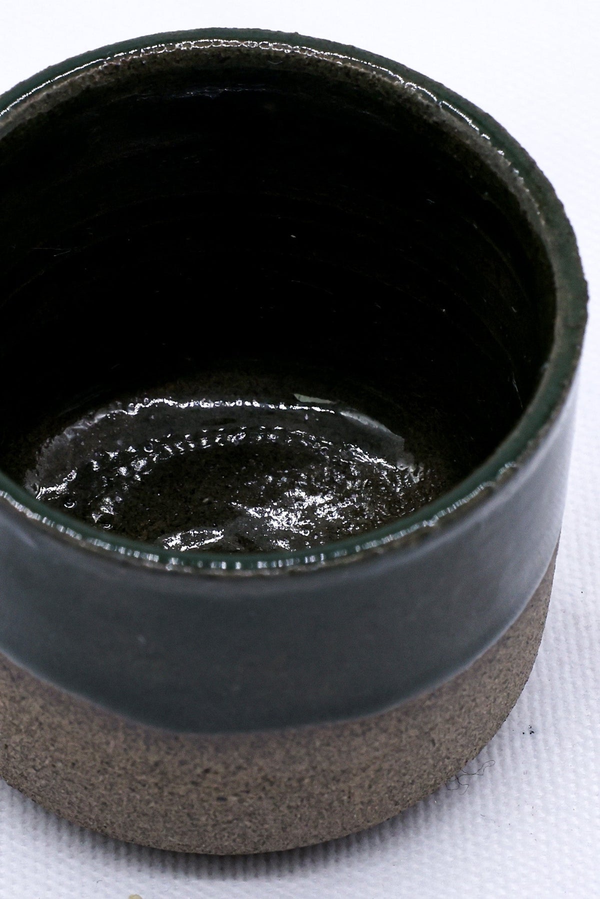 Green Picollo smoked grey handmade ceramic espresso mug by Ribera Handmade Ceramics, featuring a sleek stoneware design.