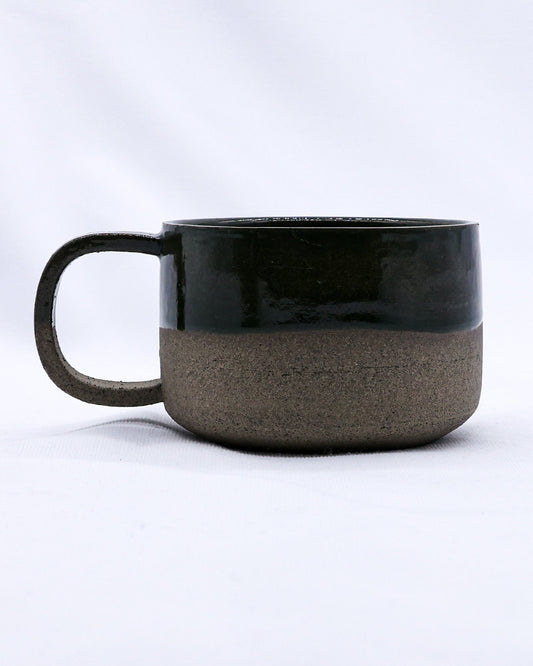 Large handmade ceramic mug by Ribera Handmade Ceramics with smoked grey stoneware finish and textured surface.
