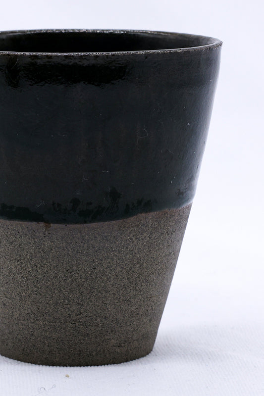 Handmade Bluverde Quadra smoked grey ceramic tall cup by Ribera Handmade Ceramics, showcasing its textured stoneware surface.
