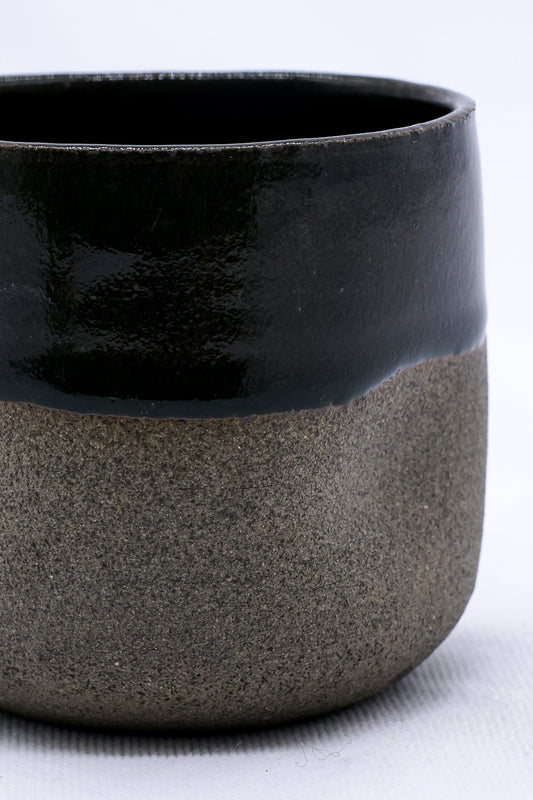 Handmade ceramic smoked grey stoneware short cup by Ribera Handmade Ceramics, showcasing its textured surface and handcrafted design.