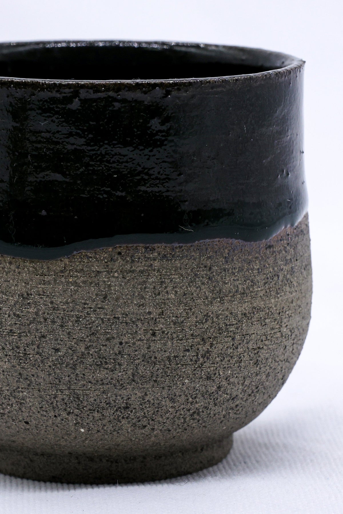 Handmade Bluverde ceramic smoked grey short cup by Ribera Handmade Ceramics, showcasing its textured stoneware surface.