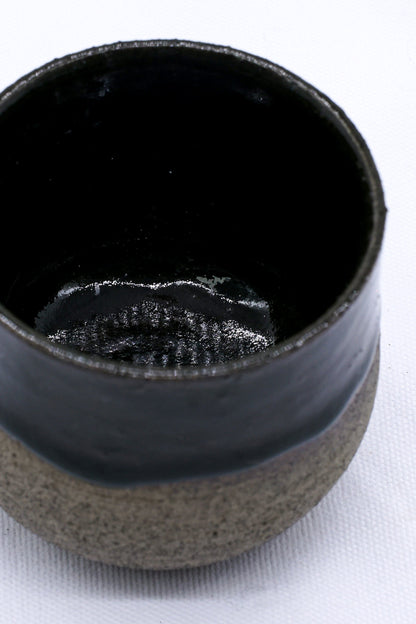 Handmade Bluverde smoked grey ceramic short cup by Ribera Handmade Ceramics, showcasing its textured stoneware surface.
