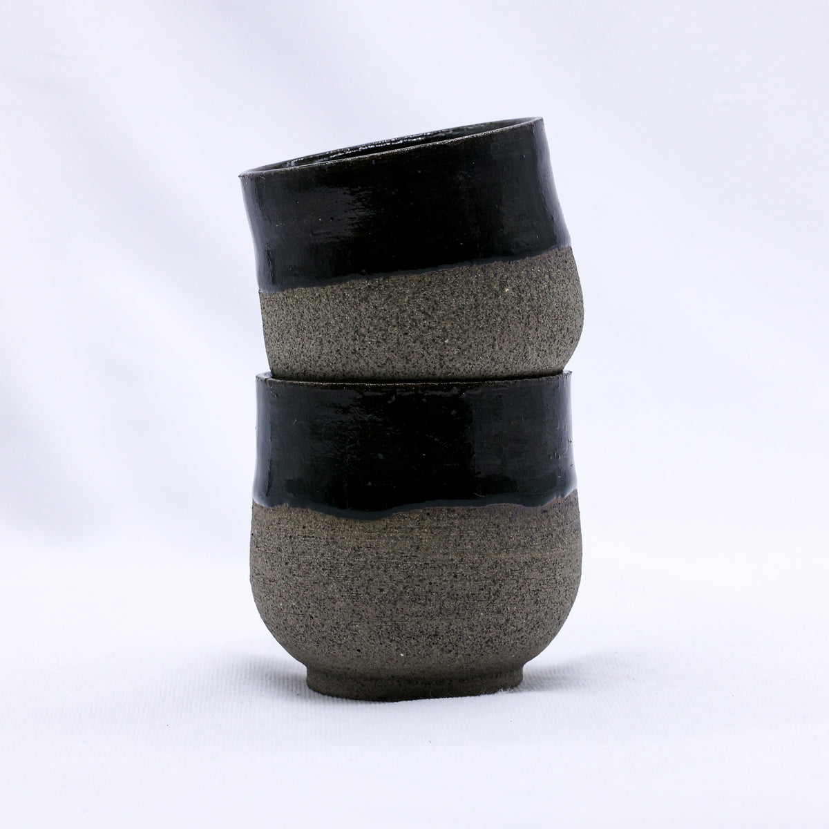 Handmade Bluverde smoked grey ceramic short cup by Ribera Handmade Ceramics, showcasing its textured stoneware surface.