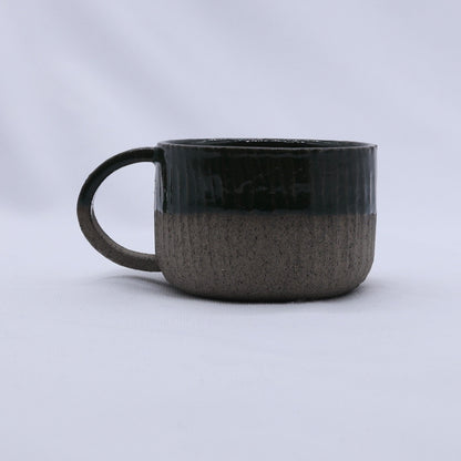 Handmade Bluverde Arte ceramic mug by Ribera Handmade Ceramics, smoked grey stoneware with a smooth, rounded handle.