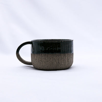 Handmade Bluverde Arte ceramic mug by Ribera Handmade Ceramics with smoked grey stoneware finish, featuring a smooth, rounded design.
