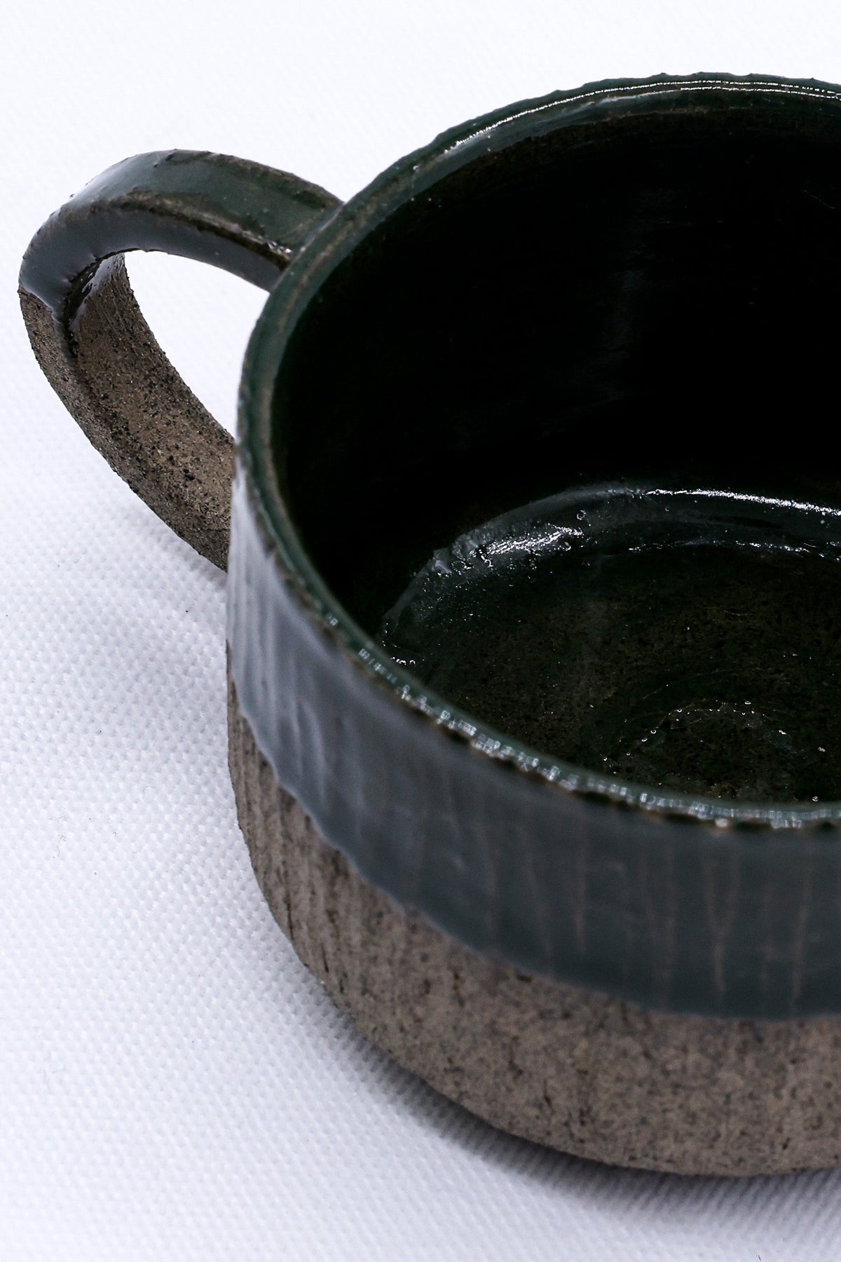 Handmade Bluverde Arte ceramic mug by Ribera Handmade Ceramics with smoked grey stoneware finish and unique textured surface.