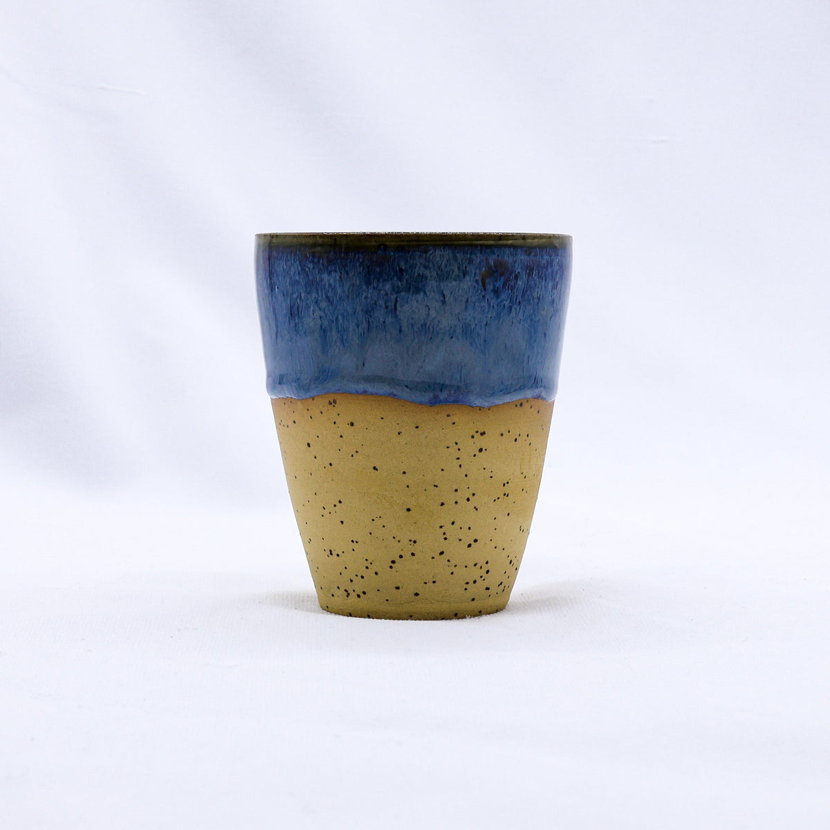 Ribera Handmade Ceramics Blunero Quadra stoneware ceramic mug with a textured, earthy finish, shown on a neutral background.