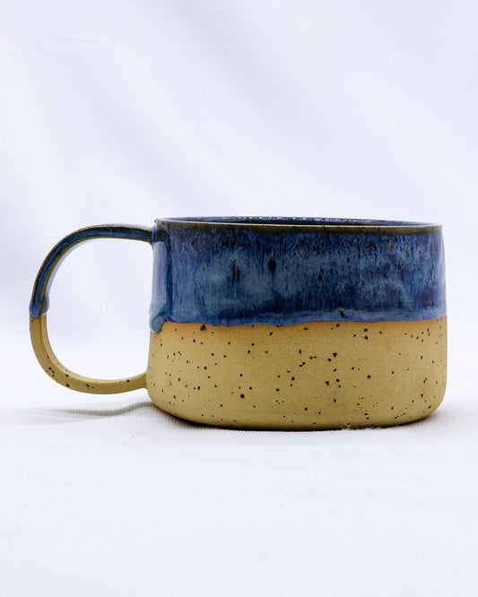 Handmade stoneware ceramic mug from Ribera Handmade Ceramics, with a rustic glazed finish and sturdy handle.