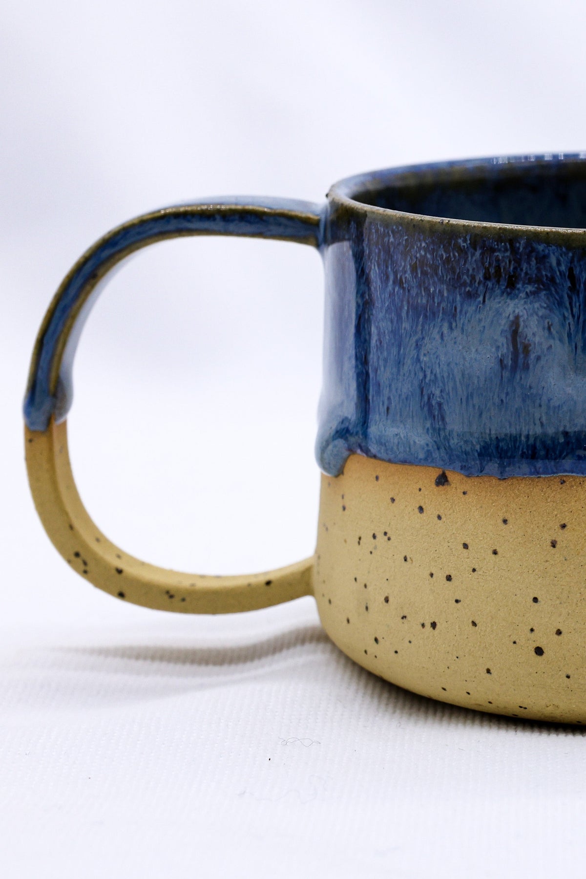 Large handmade stoneware ceramic mug by Ribera Handmade Ceramics, featuring a textured, earthy finish and sturdy handle.