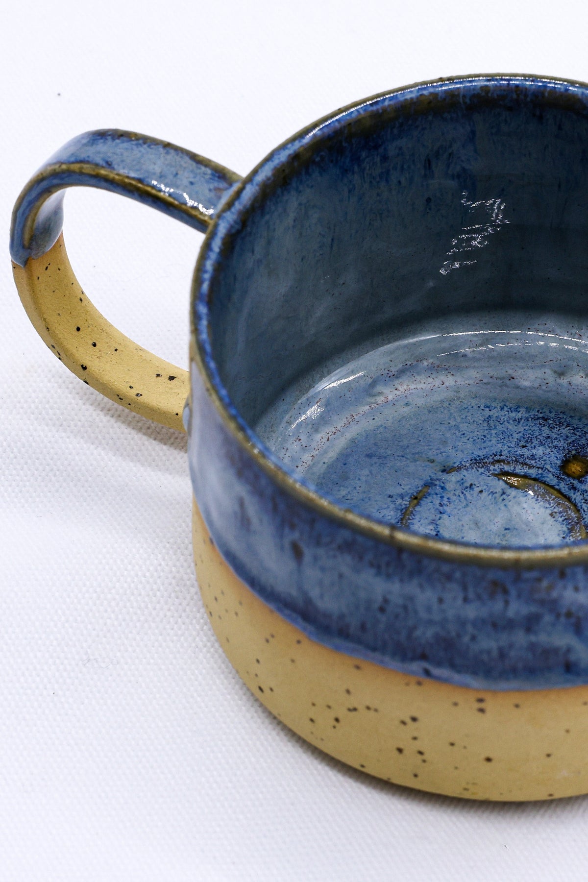 Large handmade stoneware ceramic mug by Ribera Handmade Ceramics, showcasing a rustic, textured finish and sturdy handle.