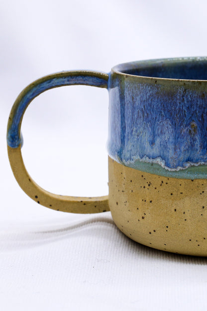 Handmade Bluverde Grande stoneware ceramic mug by Ribera Handmade Ceramics, showing its textured blue glaze and sturdy handle.