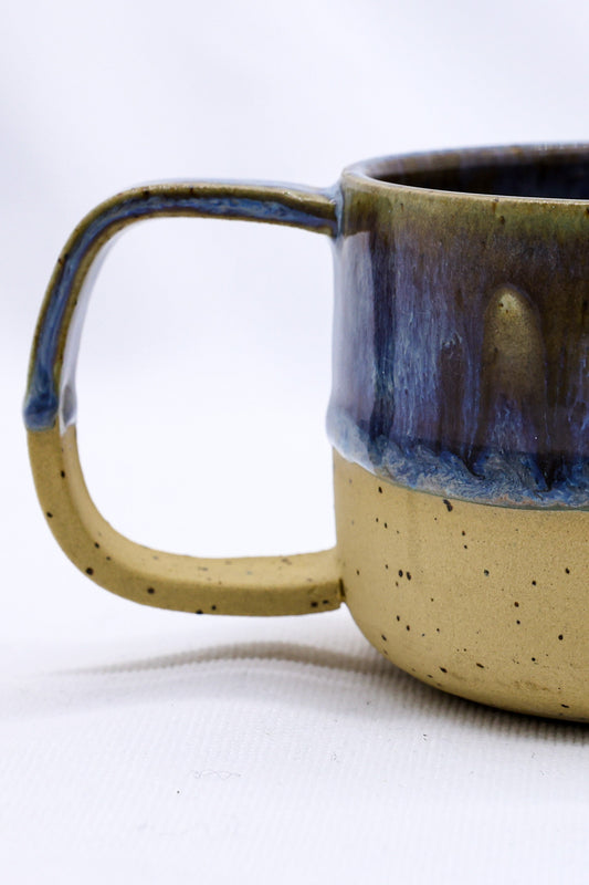 Ribera Handmade Ceramics Bluvio Grande stoneware ceramic mug with a textured, handmade finish and earthy color tones.