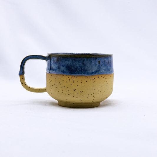 Bluverde Sienna handmade stoneware ceramic mug by Ribera Handmade Ceramics, showcasing its textured blue and sienna glazed surface.
