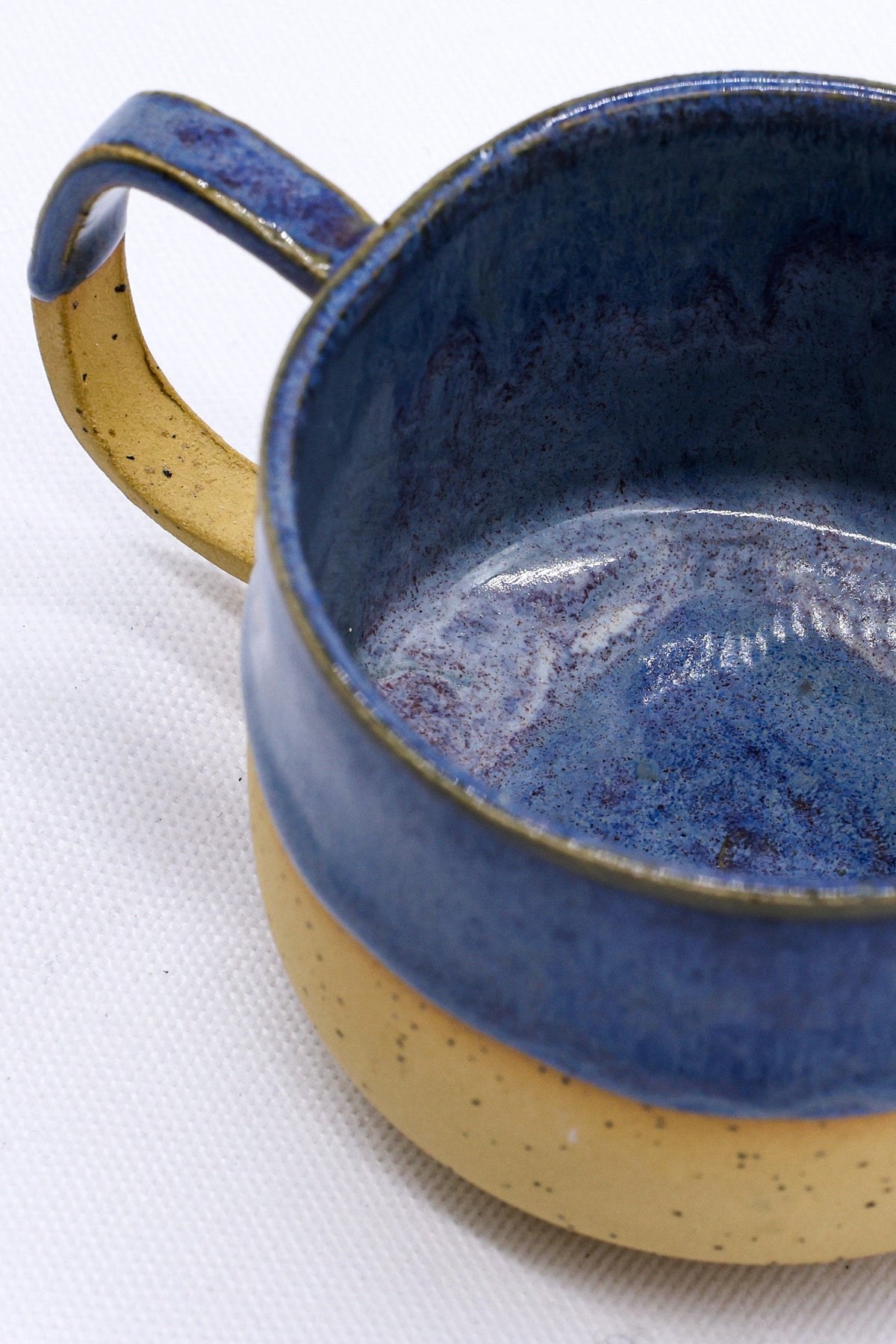 Ribera Handmade Ceramics Bluvio Sienna stoneware ceramic mug with a smooth finish and earthy color, perfect for hot beverages.