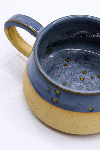 Ribera Handmade Ceramics Bluvio Belluma stoneware ceramic mug featuring a textured, handcrafted design with earthy tones.