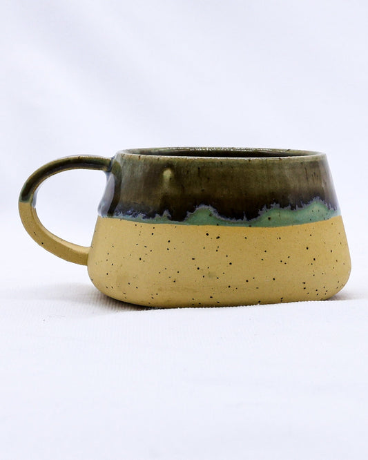 Ribera Handmade Ceramics Bluvio Belluma ceramic mug with a textured stoneware finish, showcasing its handcrafted, earthy design.