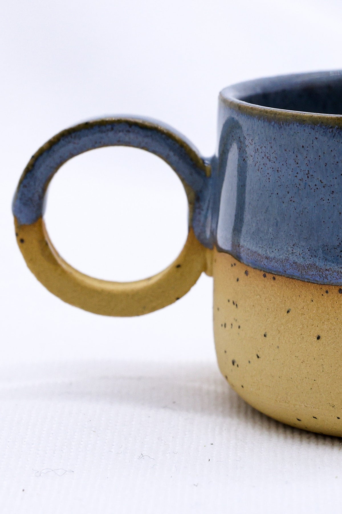 Handmade Perugia stoneware ceramic mug by Ribera Handmade Ceramics, showcasing a textured, artisanal finish.