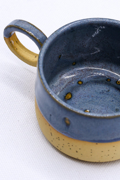 Handmade stoneware ceramic mug from Ribera Handmade Ceramics with a textured brown glaze, featuring a sturdy handle and artisanal finish.