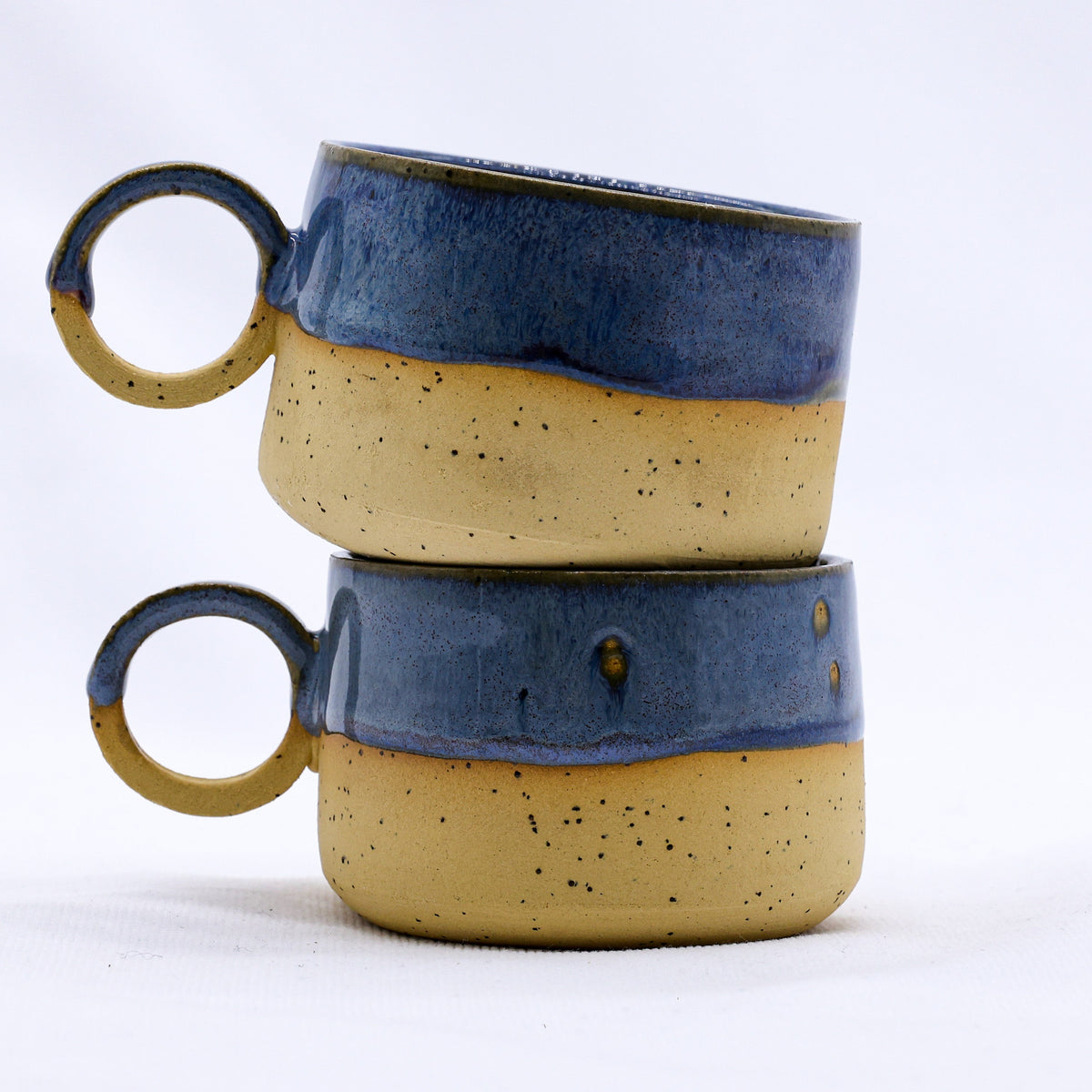 Handmade stoneware ceramic mug by Ribera Handmade Ceramics featuring a textured, earthy design.