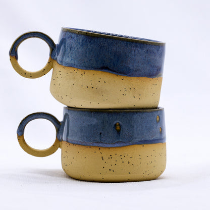 Handmade stoneware ceramic mug by Ribera Handmade Ceramics featuring a textured, earthy design.