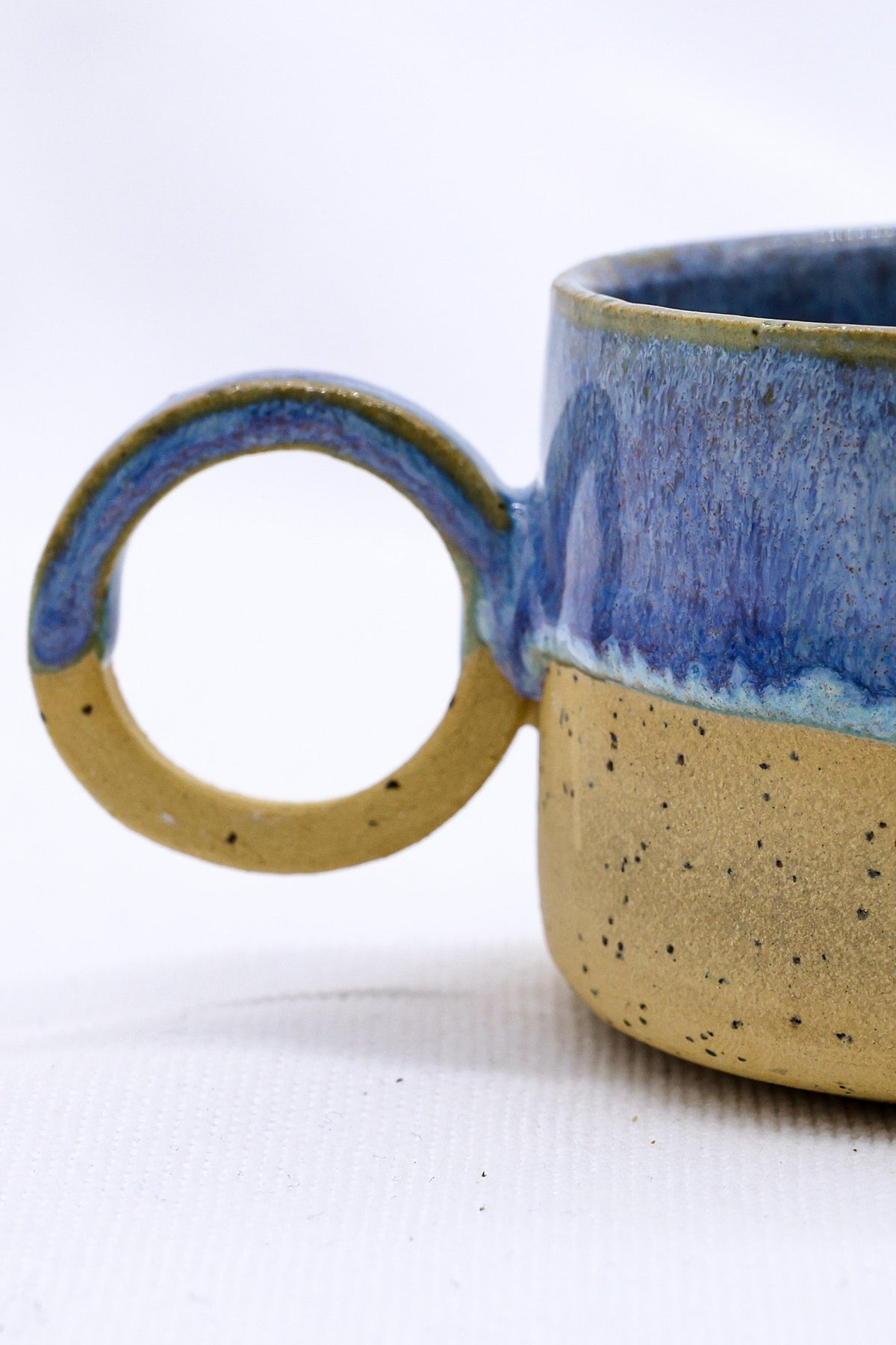 Handmade Blulume Perugia stoneware ceramic mug by Ribera Handmade Ceramics, featuring a blue glaze and textured ceramic surface.