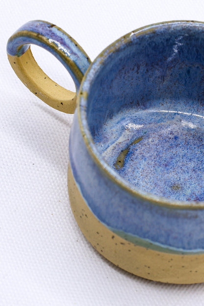 Handmade stoneware ceramic mug from Blulume Perugia by Ribera Handmade Ceramics, showcasing its textured ceramic surface and unique shape.