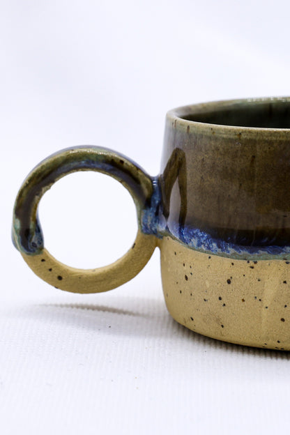 Bluvio Perugia handmade stoneware ceramic mug by Ribera Handmade Ceramics, featuring a textured, earthy finish and ergonomic handle.