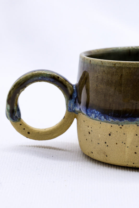 Bluvio Perugia handmade stoneware ceramic mug by Ribera Handmade Ceramics, featuring a textured, earthy finish and ergonomic handle.