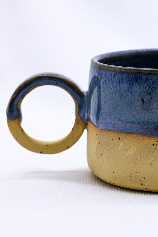 Blue and earthy-toned Bluvio Perugia handmade stoneware ceramic mug by Ribera Handmade Ceramics with a textured finish.