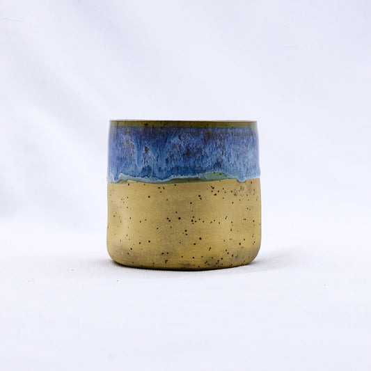 Handmade ceramic stoneware cup from Ribera Handmade Ceramics with a textured Goccia design and a glossy finish.