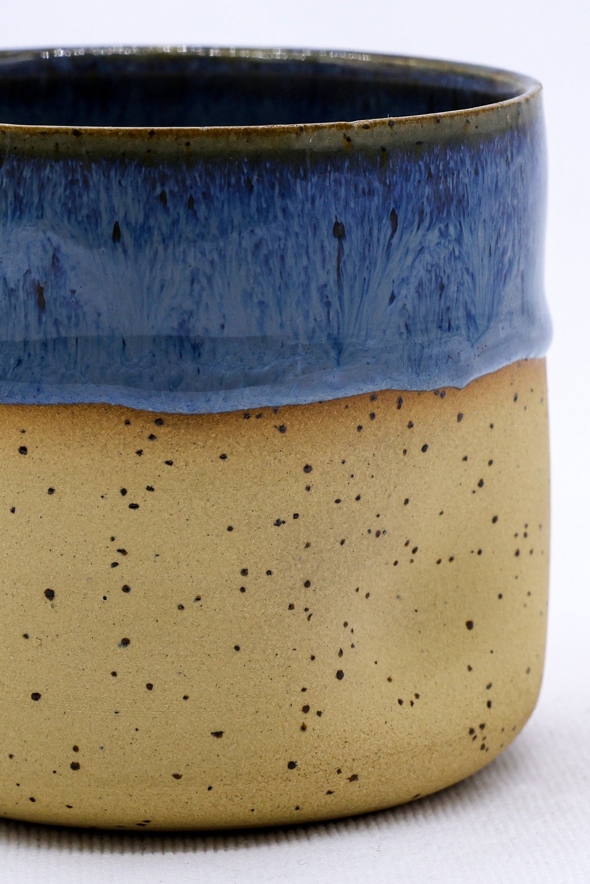 Handmade ceramic stoneware cup by Ribera Handmade Ceramics featuring a blue glaze and handcrafted design.