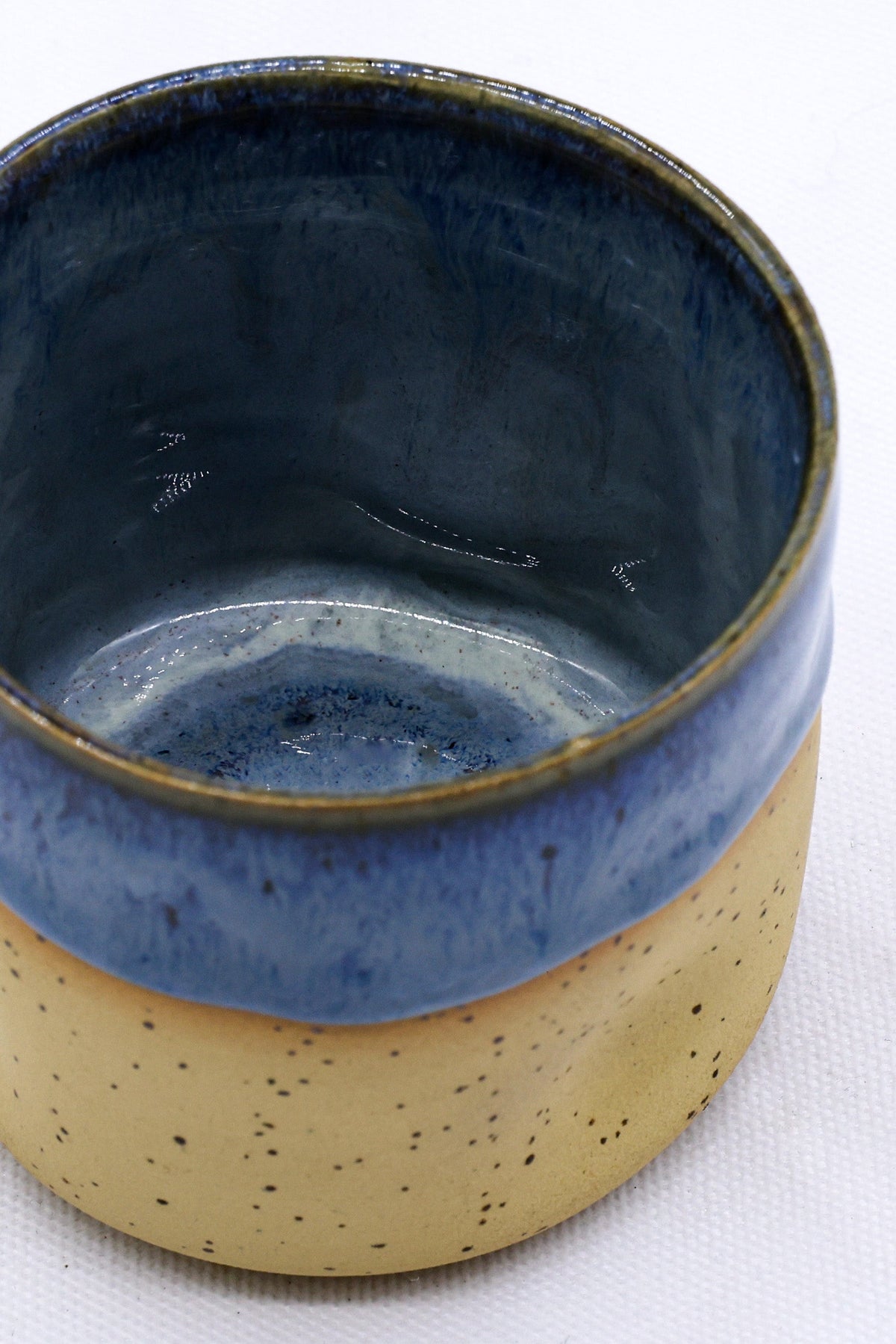 Ribera Handmade Ceramics Blunero Goccia ceramic stoneware cup with a blue glaze and unique handcrafted design.