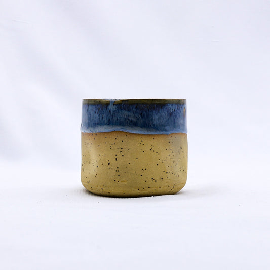 Handmade ceramic Goccia stoneware cup by Ribera Handmade Ceramics, featuring a smooth, glazed finish and elegant design.