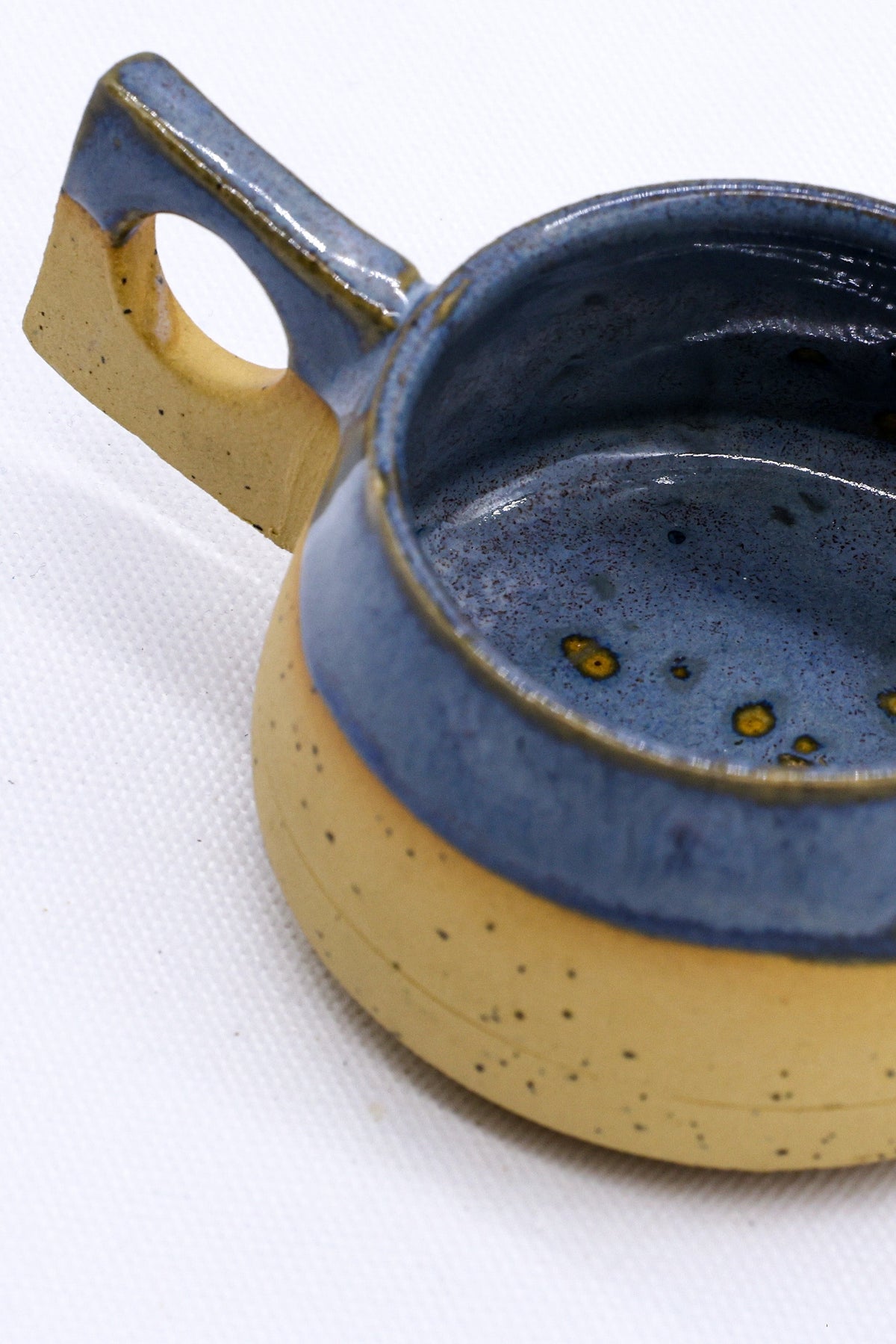 Handmade TerraBlu Formo ceramic coffee mug by Ribera Handmade Ceramics, featuring a textured stoneware finish and ergonomic handle.