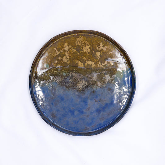 Large 27 cm Oceanis smoked grey ceramic dinner plate by Ribera Handmade Ceramics, showcasing a handcrafted stoneware design.