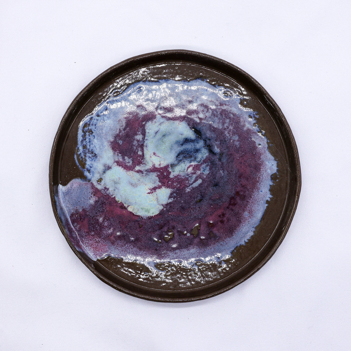 Large 23 cm Nebula Smoked Grey stoneware ceramic dinner plate by Ribera Handmade Ceramics showing a textured, handcrafted design