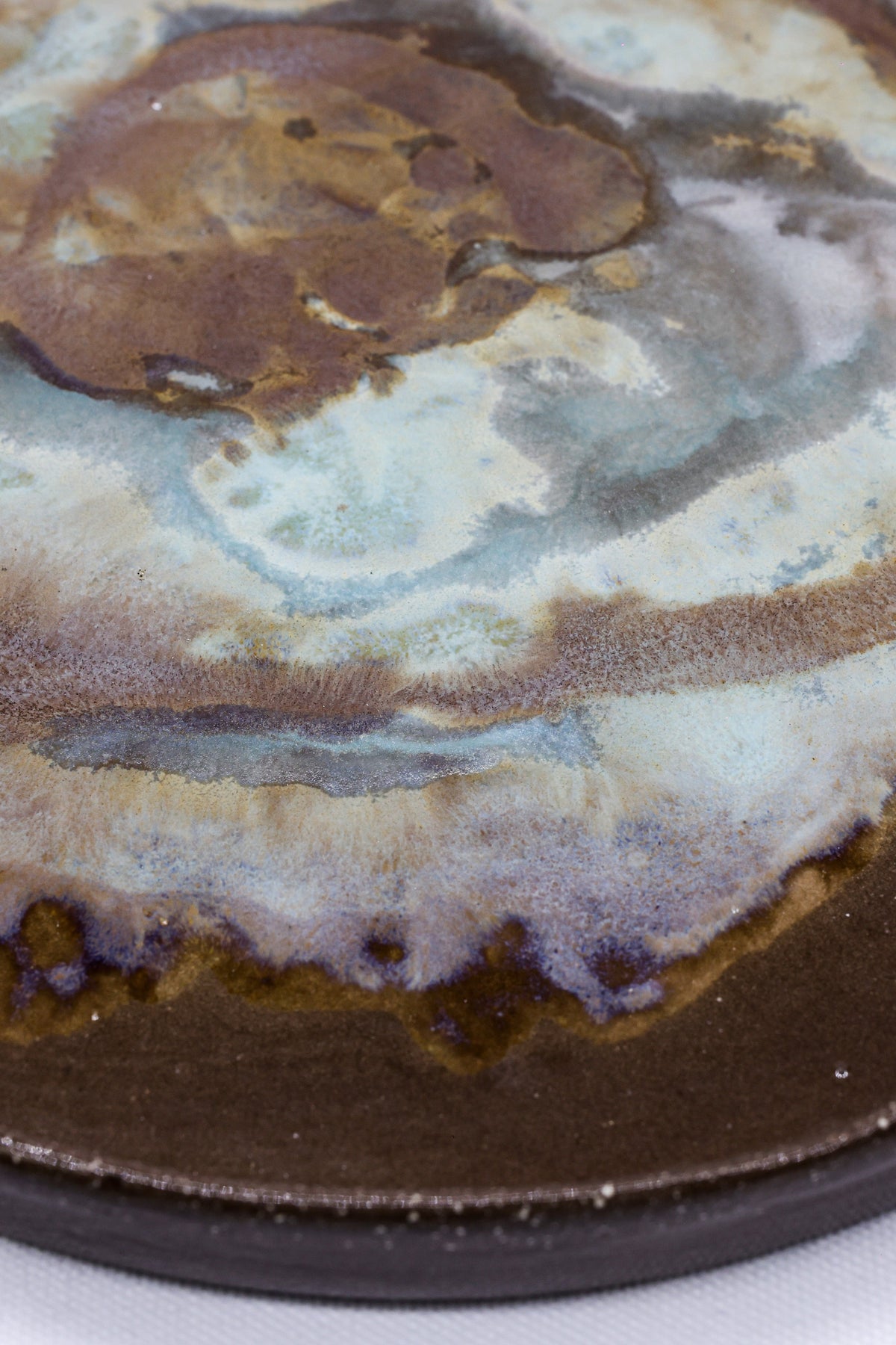 Large 23 cm Tidepool Smoked Grey ceramic dinner plate by Ribera Handmade Ceramics featuring a textured stoneware finish.